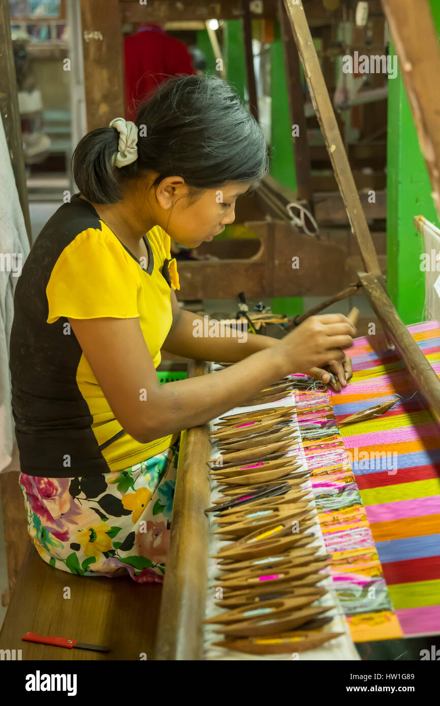 Silk Weaving Factory Worker near Amarapura, Myanmar Stock Photo