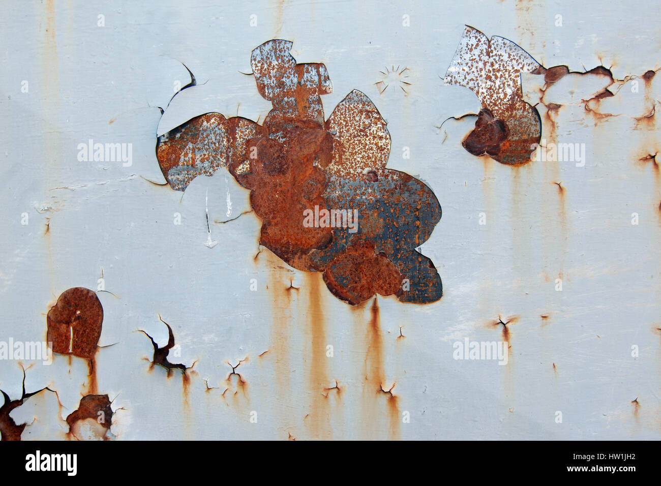 Rusty iron surface with peeling paint - grunge texture Stock Photo