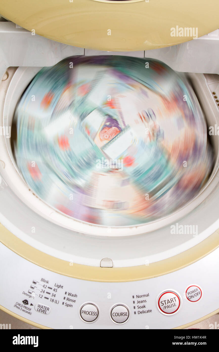 Money laundering concept with Ringgit Malaysia notes in washing machine ...