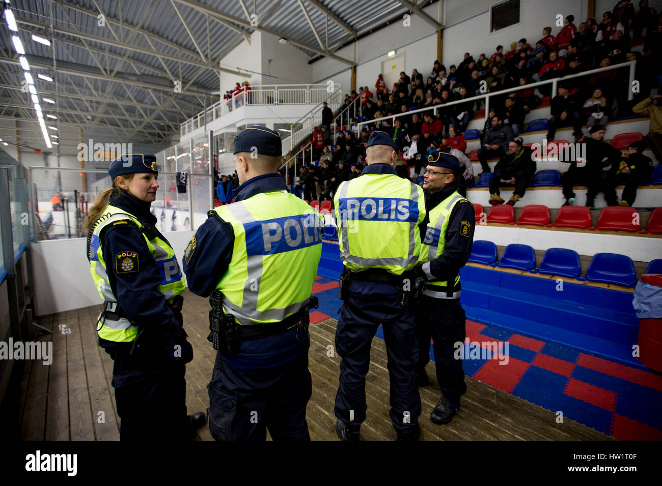 The police keep order during an ice hockey game, Sollentuna, Sweden. Stock Photo