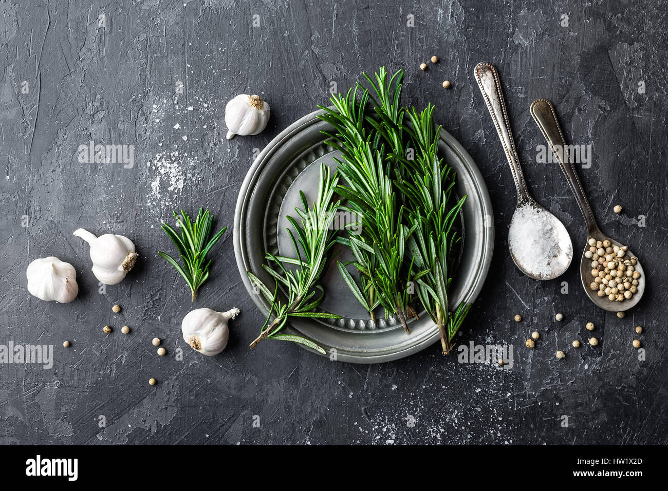 Rosemary, garlic, salt and white pepper, culinary background with