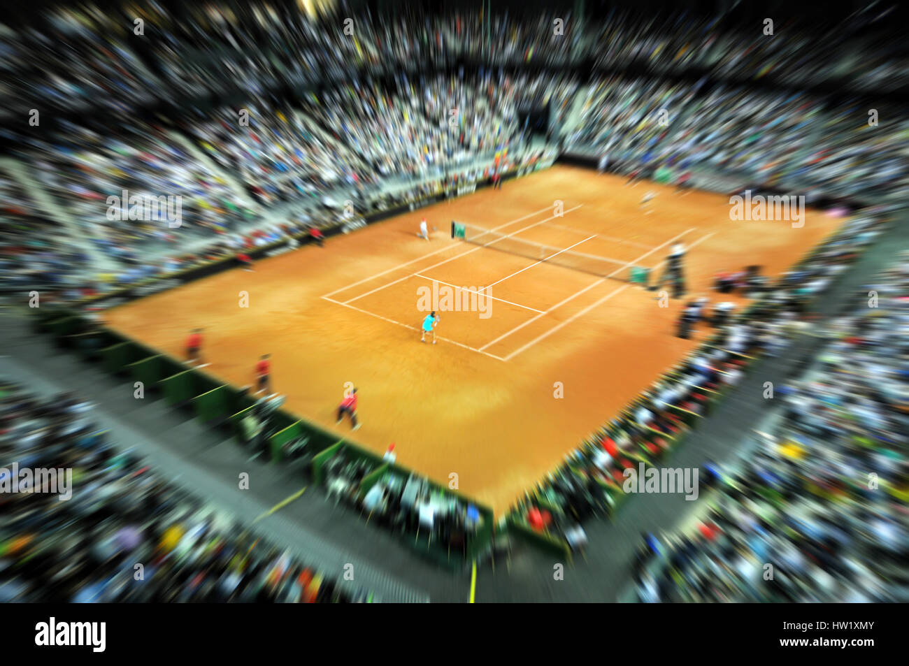 Blurred sports tennis arena with public in a dynamic motion. Zoom in effect Stock Photo