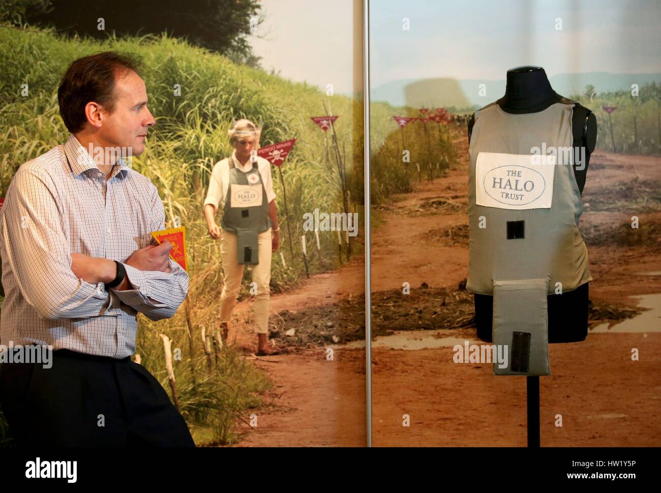 James Cowan, CEO of The Halo Trust, takes a closer look at the body armour worn by Diana, Princess of Wales, on her visit to an Angolan minefield in 1997. The exhibit features in the new exhibition at the National War Museum in Edinburgh called 'Safer Steps: The Work of the HALO Trust' which highlights the work undertaken by the world's largest humanitarian mine clearance organisation. Stock Photo