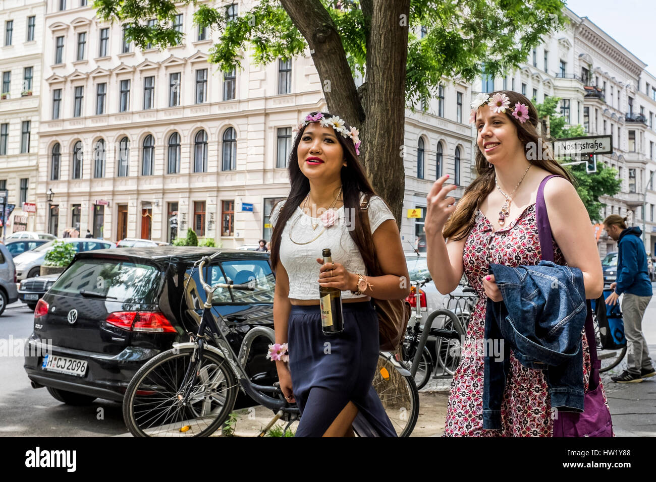 Two girls walking down street hi-res stock photography and images - Alamy