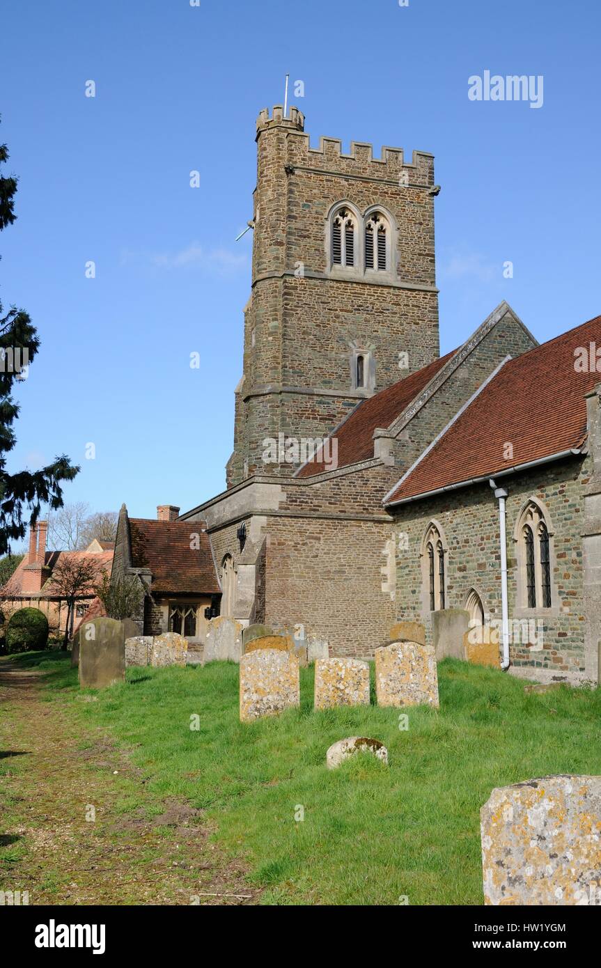 St James Church, Husborne Crawley, Bedfordshire, is unique in having a tower, which was built with rare green sandstone as well  brown. Stock Photo