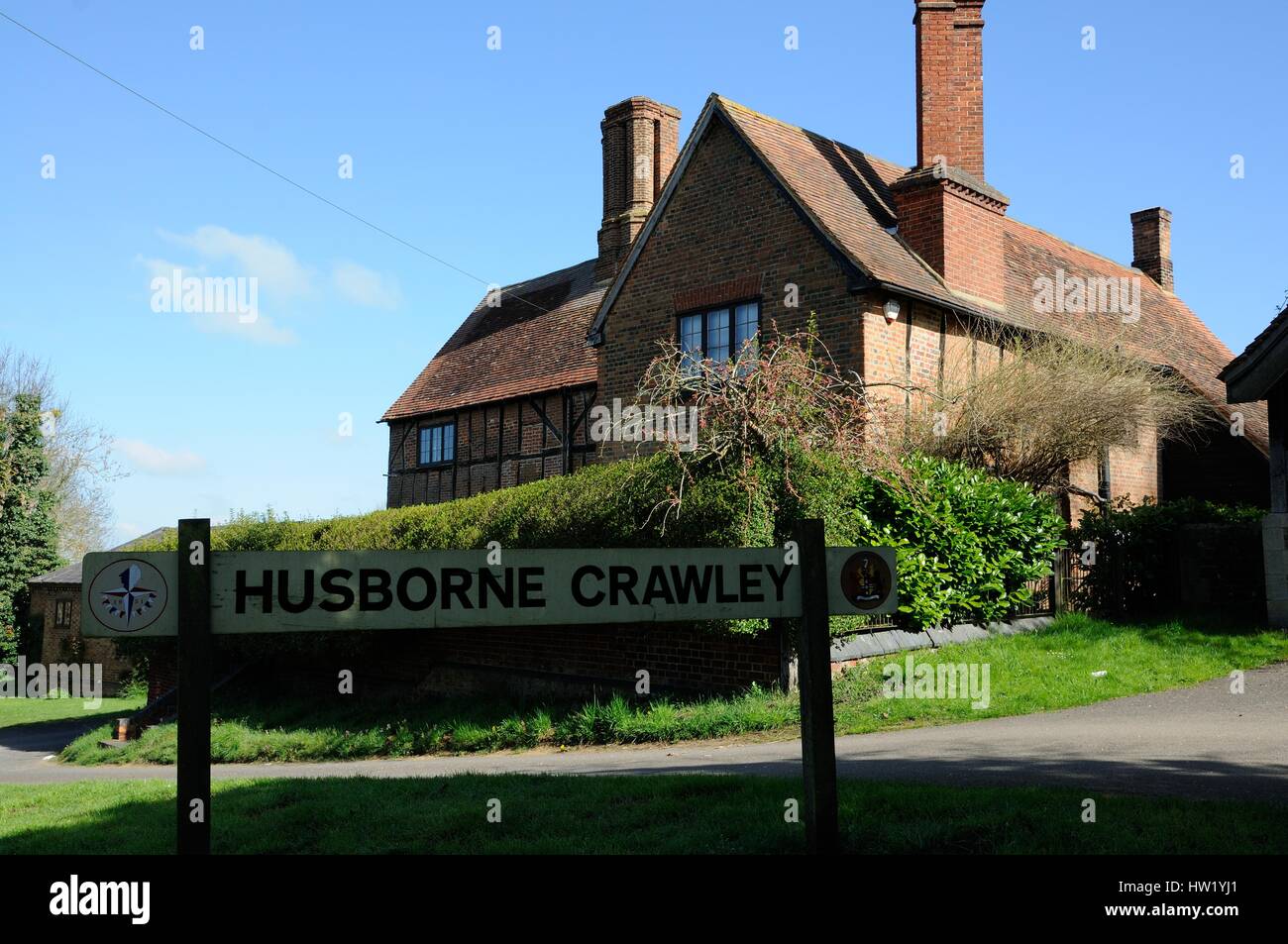Manor Farm House, Husborne Crawley, Bedfordshire, stands in front of the church is a half-timbered building with brick infilling, and a tall chimney.  Stock Photo