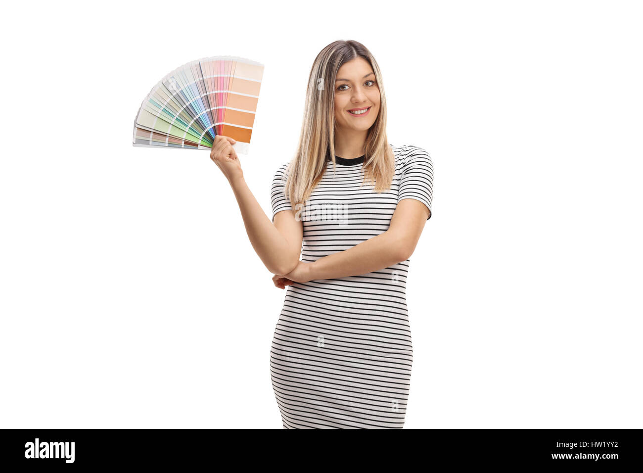 Pretty girl holding a color swatch and smiling isolated on white background Stock Photo