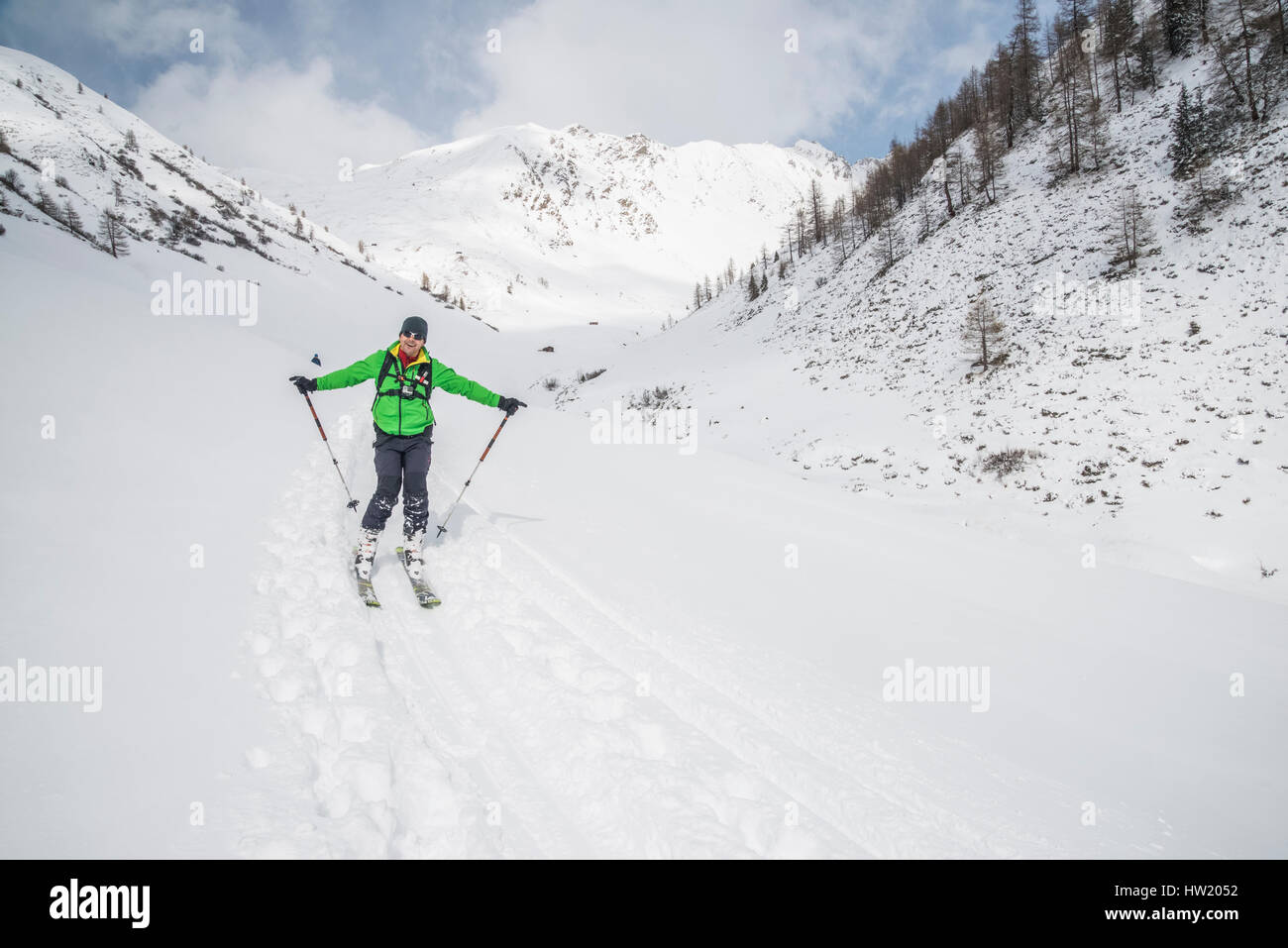 Ski tourers exploring the mountains of the Villgratental in Ost Tirol of Austria near the South Tirol border with Italy Stock Photo