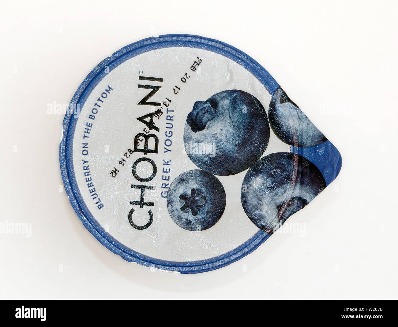 Top view of a container of blueberry Chobani Greek yogurt against white ...