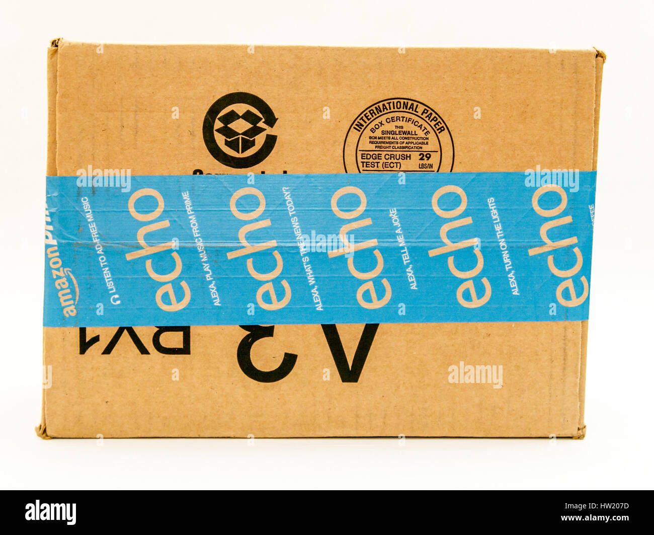 A cardboard shipping box from Amazon against white background. Stock Photo