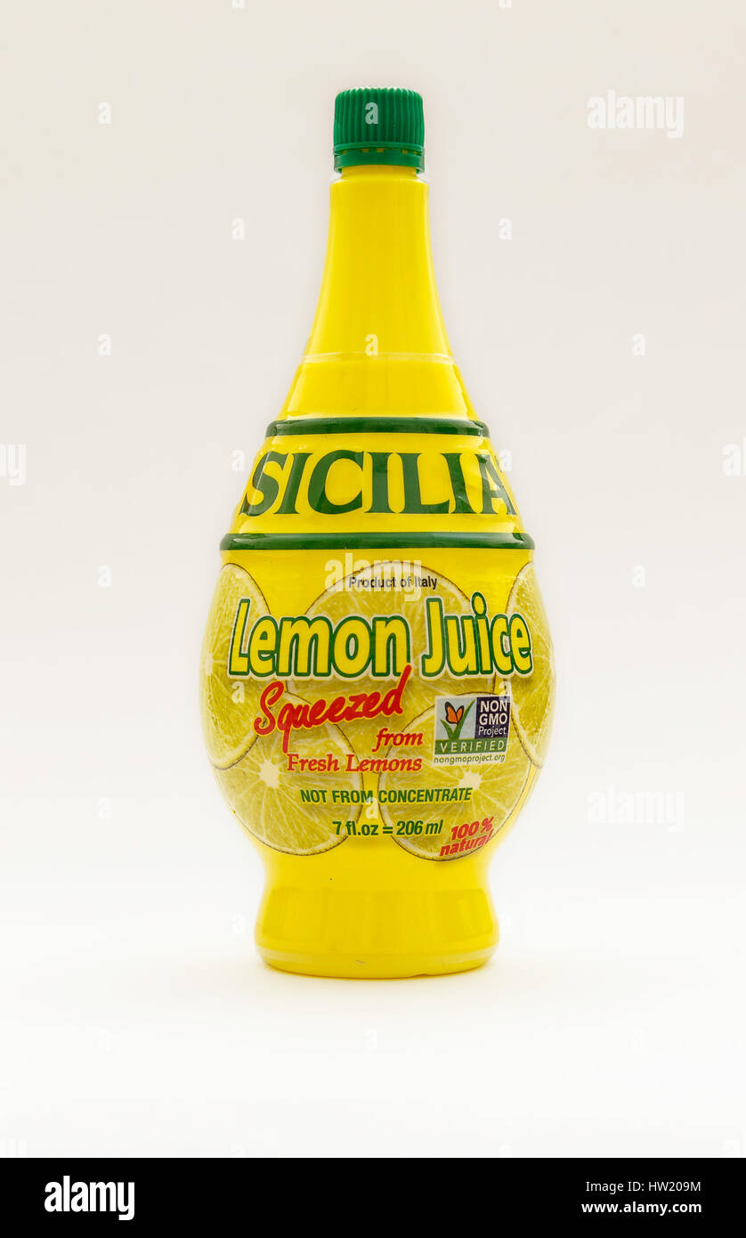Bottle of Sicilia lemon juice isolated on white background Stock Photo