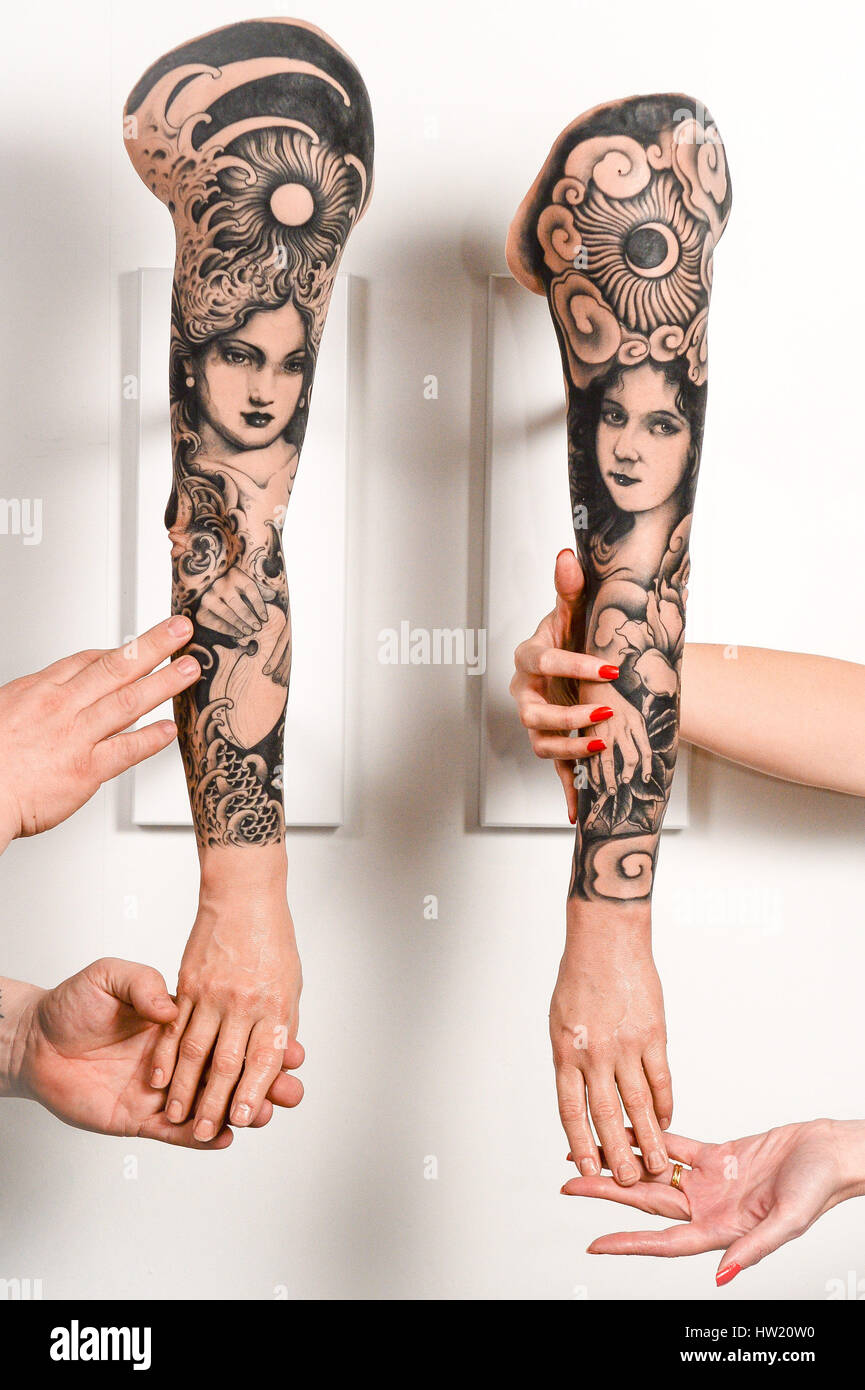 Tattoo designs on silicone arms on display at the National Maritime Museum in Falmouth, Cornwall, part of the exhibition Tattoo: British Tattoo Art Revealed. Stock Photo