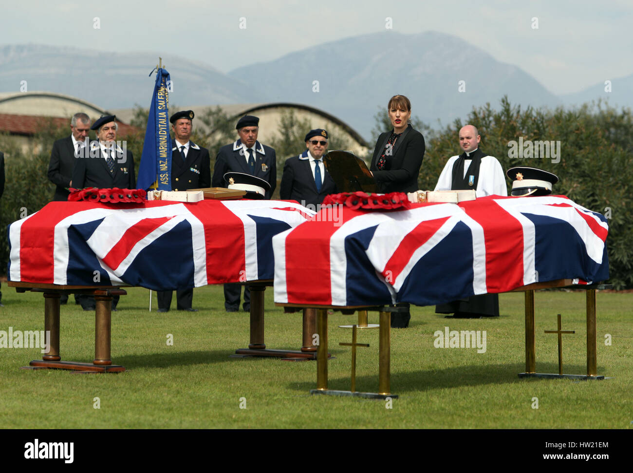 Jill Morris, British Ambassador to Italy and san Marino reads a poem during the burial service for Lance Corporal Ronald George Blackham from Northwich, Cheshire and two unknown soldiers at the Commonwealth War Graves Commission (CWGC) Salerno War Cemetery, in Italy, who were all killed in WWII, during a fierce battle on 25 September 1943 on Hill 270, near the village of Capezzano. Stock Photo