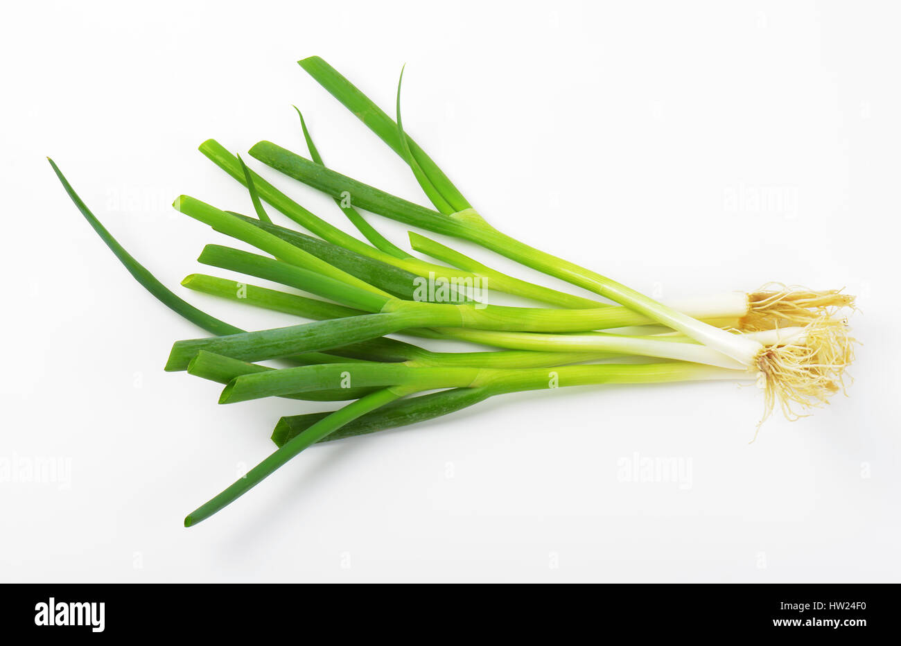 Fresh green onions on white background Stock Photo - Alamy