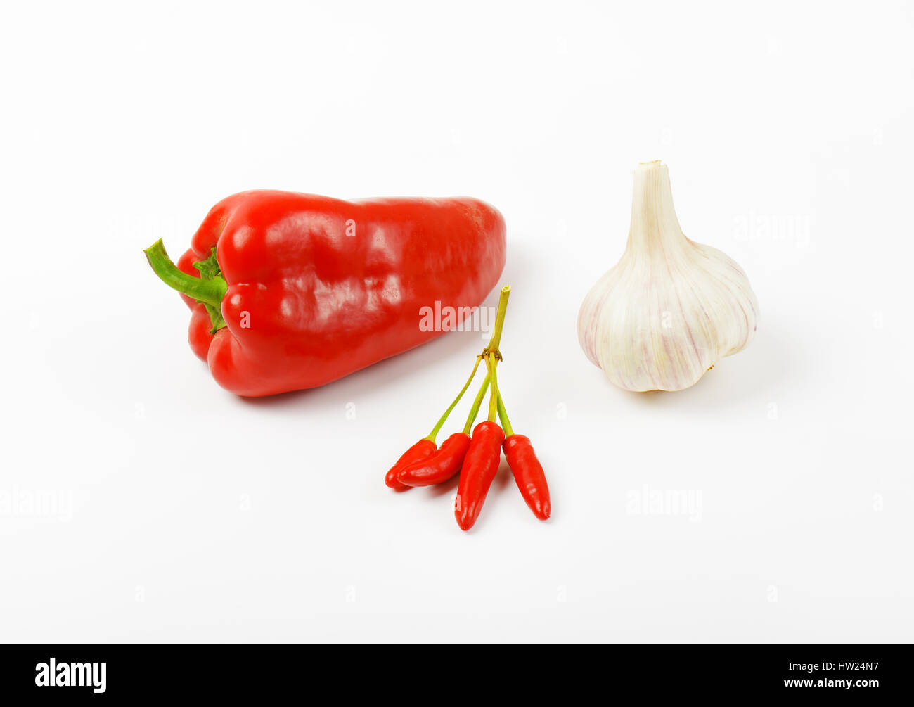 Red sweet pepper, chili peppers and garlic on white background Stock ...