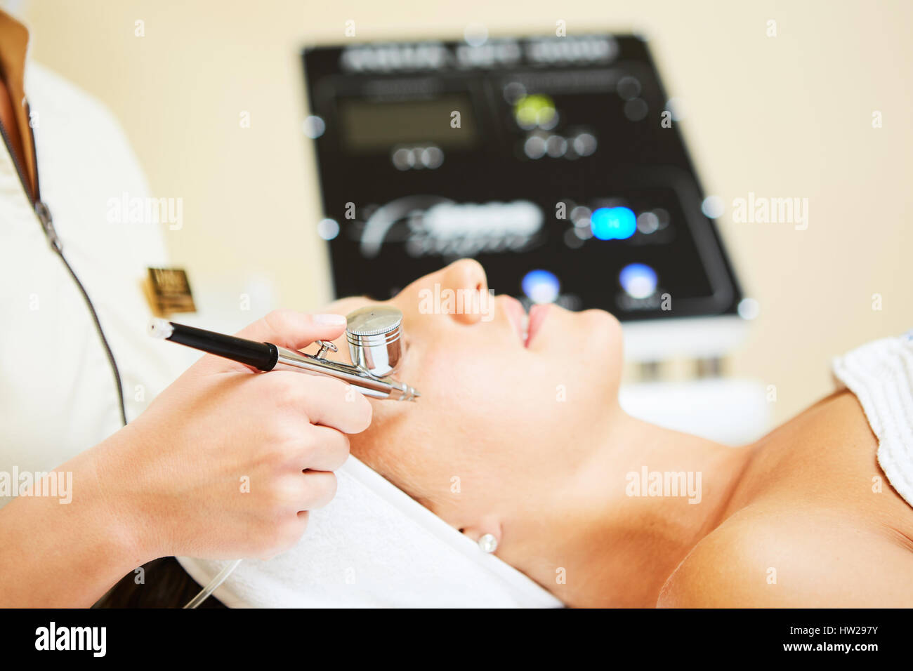 Procedure of Microdermabrasion. Mechanical Exfoliation, diamond polishing. Model, closeup