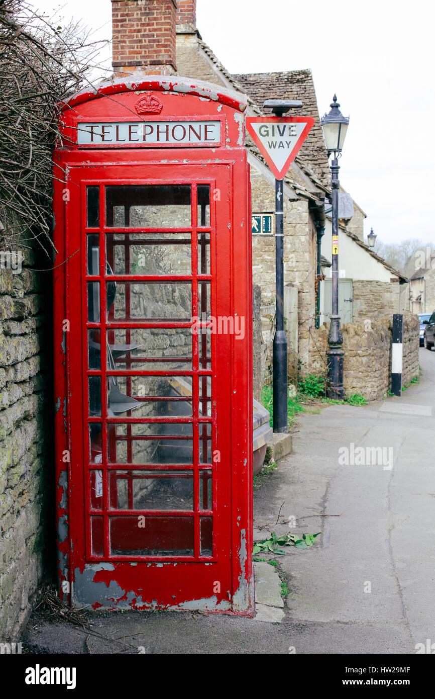 Old red telephone box with paint peeling off in a small English village Stock Photo Alamy