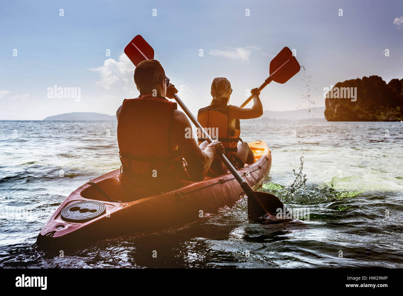 Man and woman kayaking in sea Stock Photo