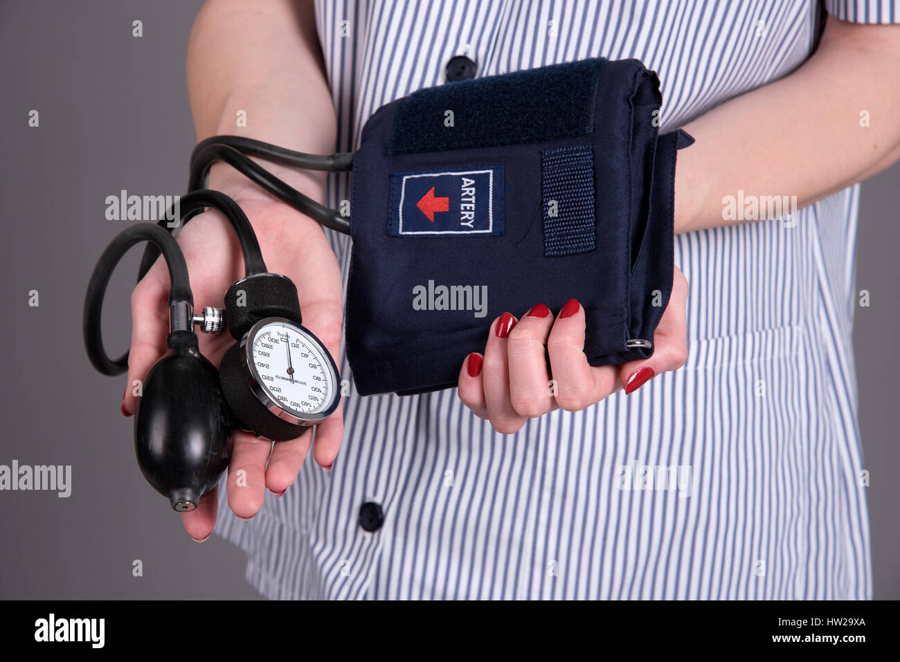 Nurse holding blood pressure measuring kit Stock Photo Alamy