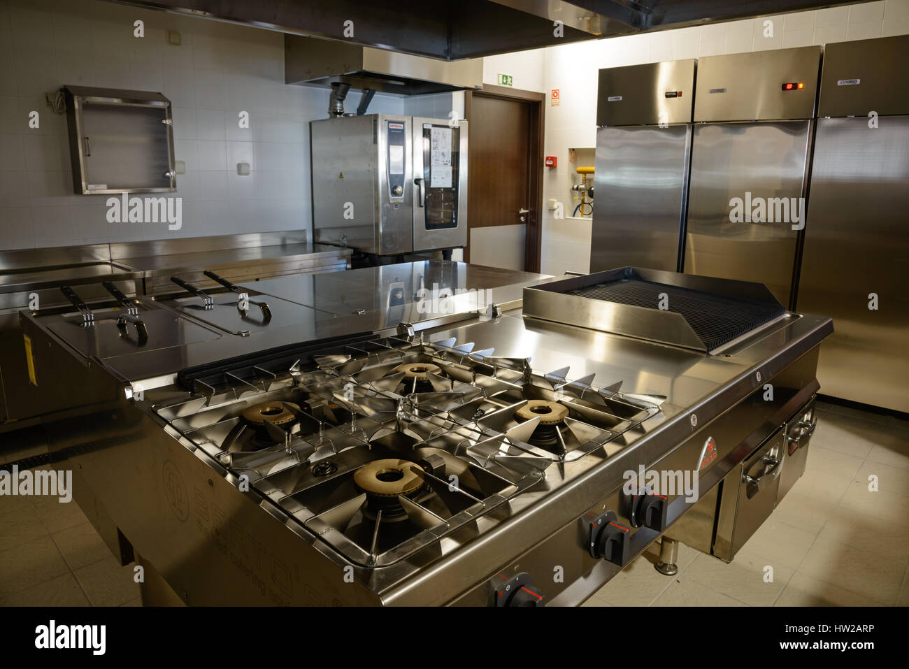 large and small pots in the industrial kitchen on the stove inside the  restaurant during the preparation of food Stock Photo - Alamy