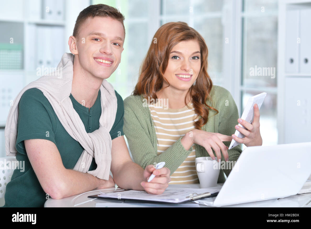 Beautiful young couple with a laptop Stock Photo - Alamy