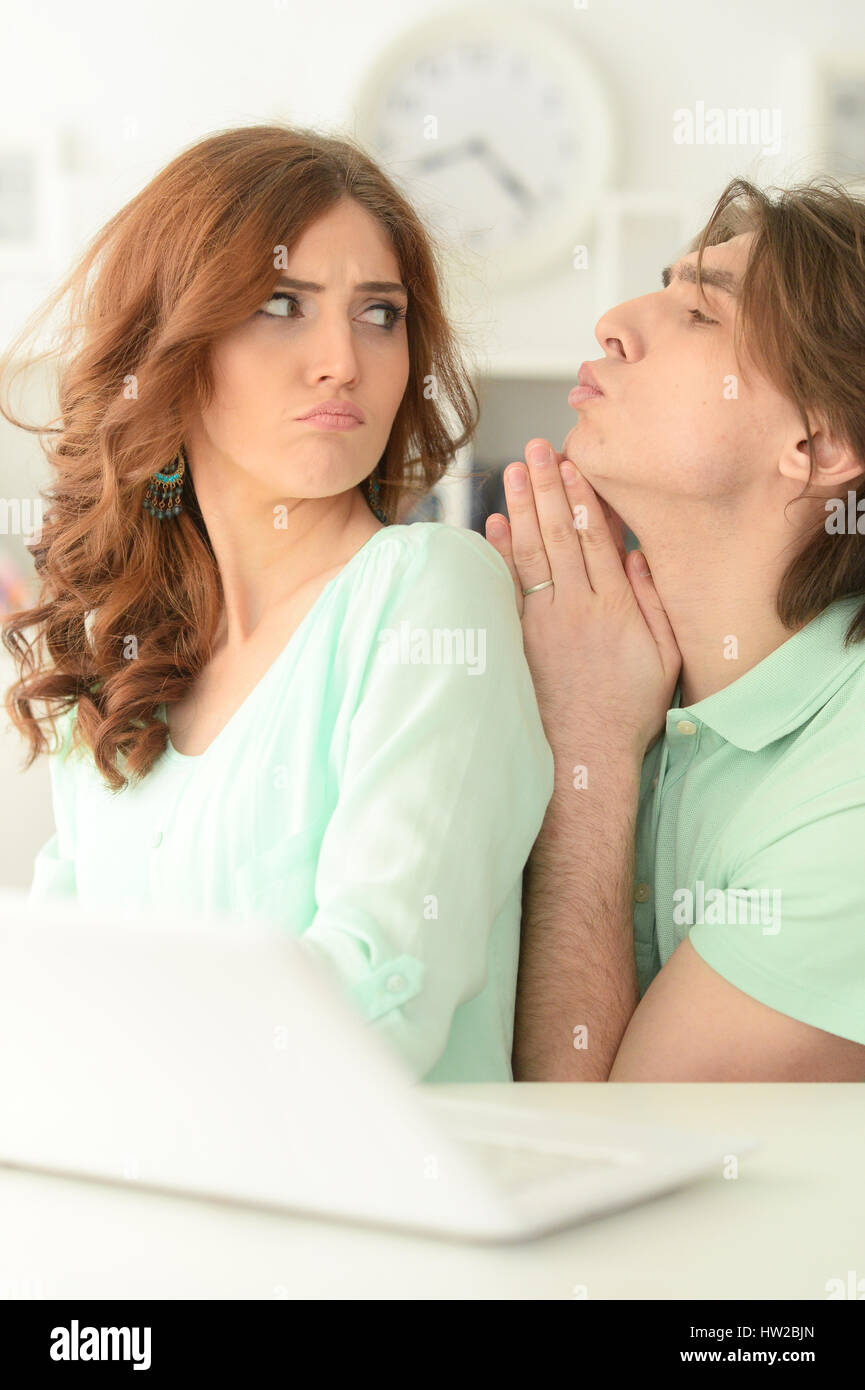 Beautiful young couple with a laptop Stock Photo - Alamy