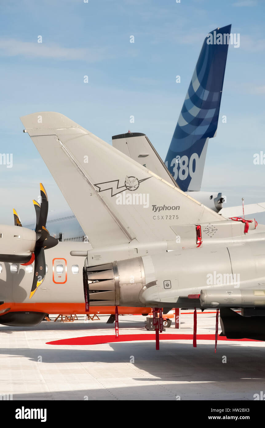 Farnborough, UK - July 24, 2010: Military and commercial aircraft tails on display at the Farnborough Airshow, Hampshire, UK Stock Photo