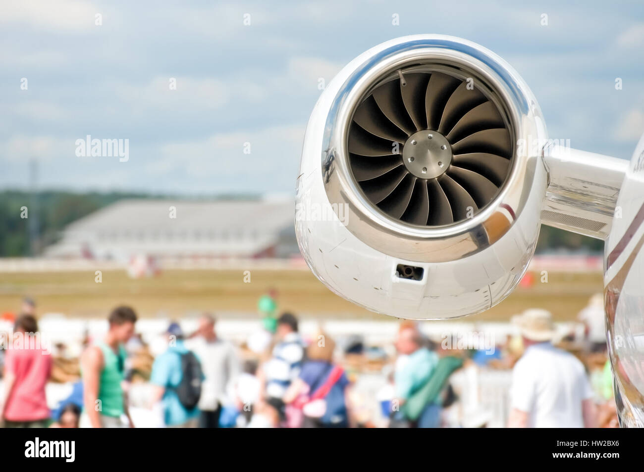 aircraft jet engine closeup and airshow crowd in the background Stock Photo