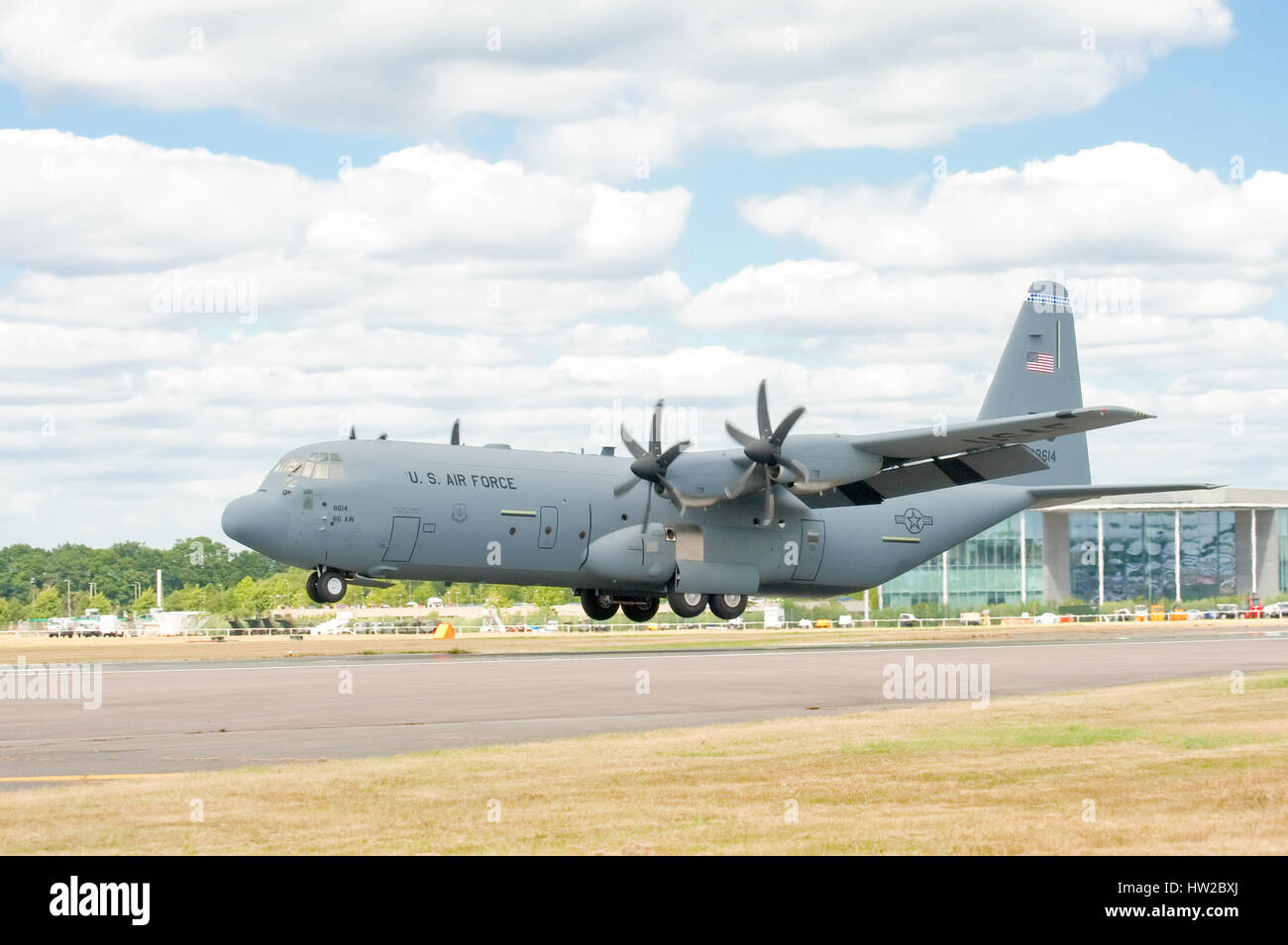 USAF C-130J cargo transporter landing at the Farnborough Airshow, UK Stock Photo