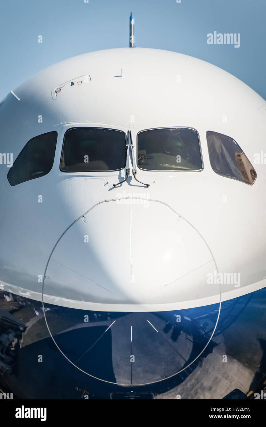 nose cone closeup of a larger passenger jet airliner Stock Photo