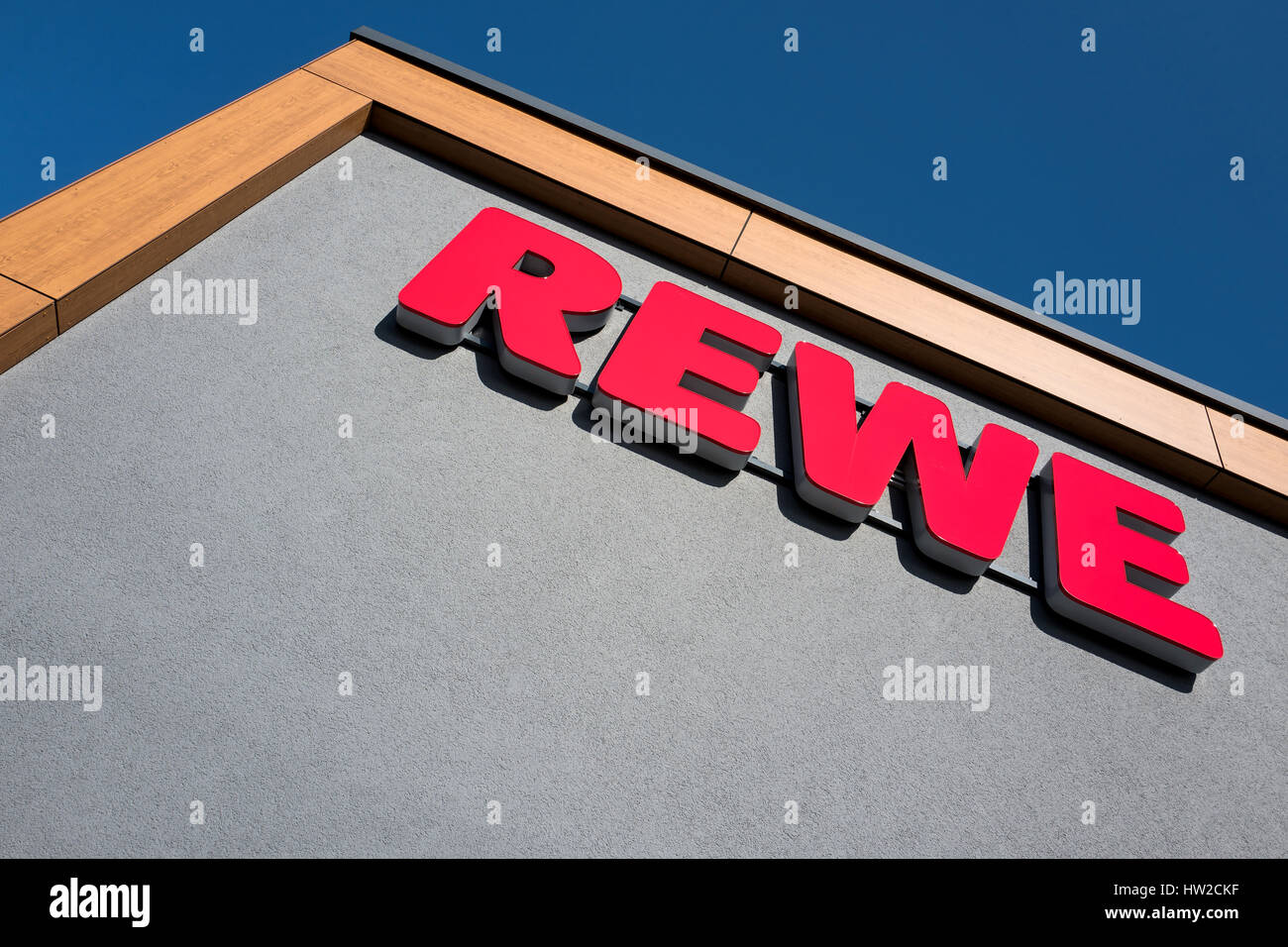 REWE sign at branch. REWE operates approximately 3,300 supermarkets in Germany. Stock Photo