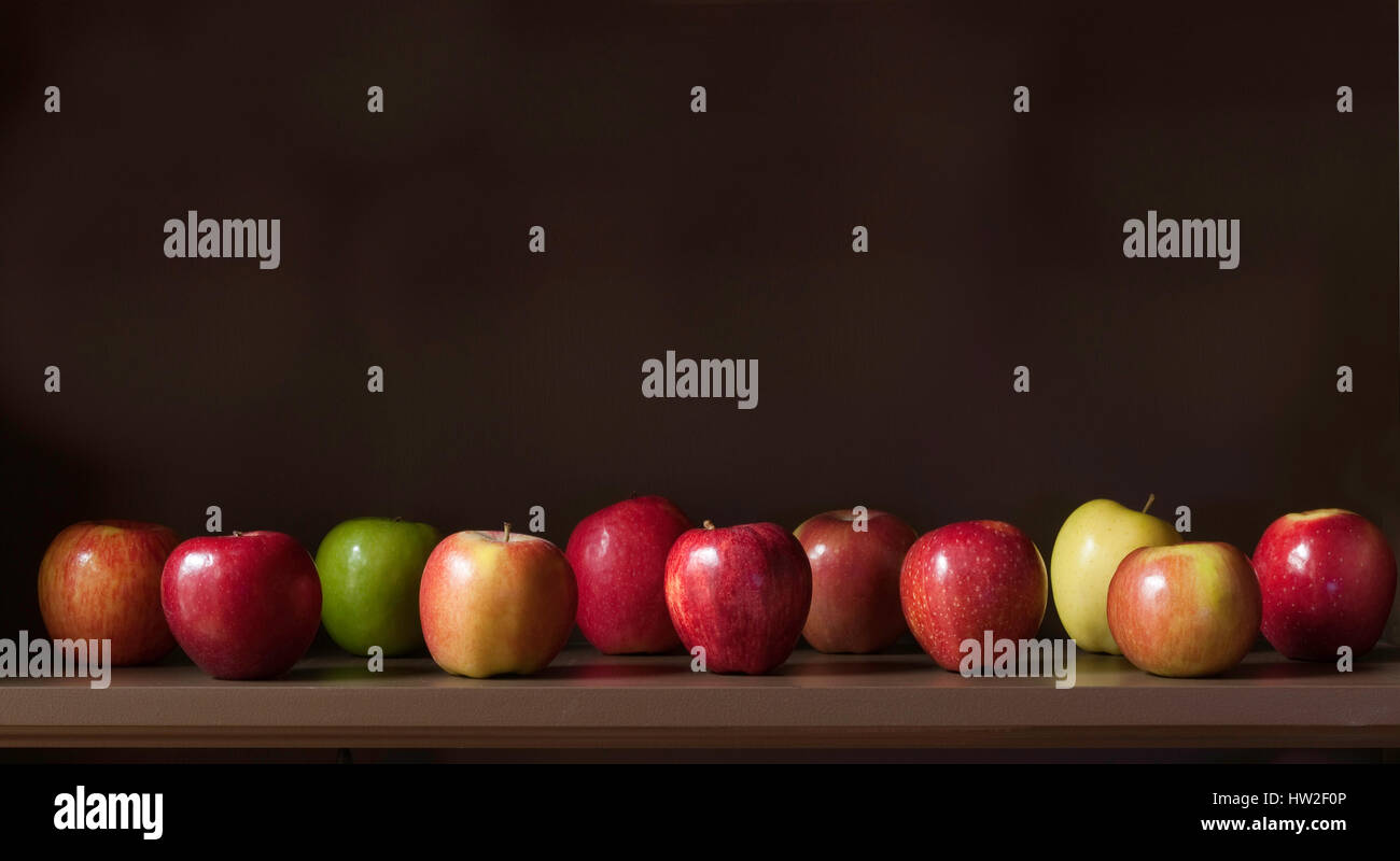 Apples ( Malus) on display Fuji, Braeburn, Granny Smith, Ambrosia