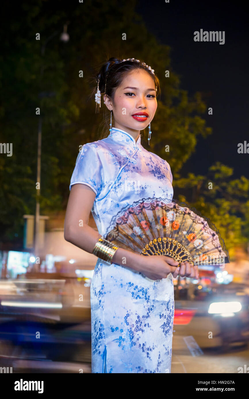 Portrait of Asian woman wearing traditional clothing holding fan Stock Photo