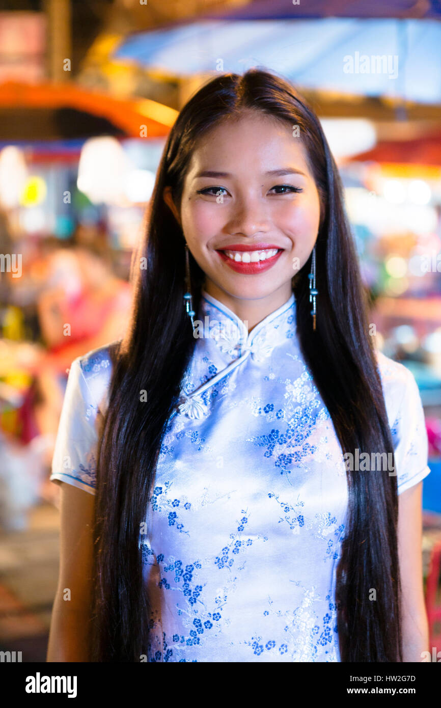 Portrait of smiling Asian woman wearing traditional clothing Stock Photo