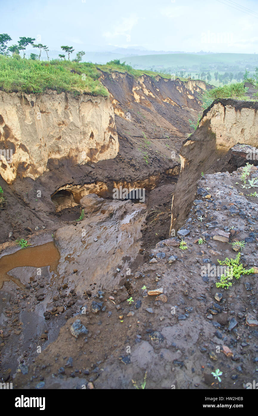 Heavy roadside erosion after torrential rainfall Stock Photo