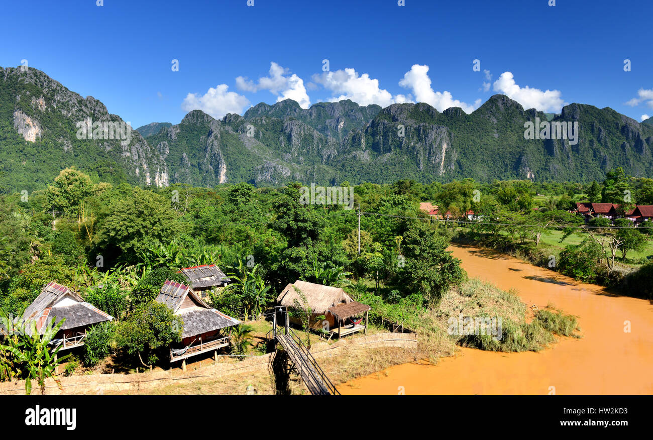 The village in vangvieng at the country side of Lao in clear sun lighting with blue sky. Stock Photo