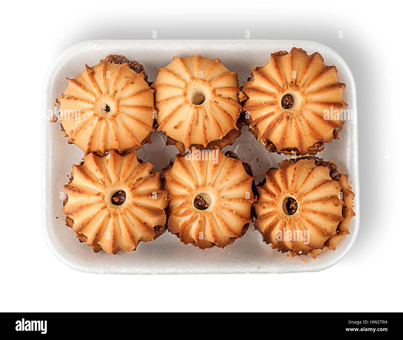 Shortbread biscuits with filling in plastic tray top view isolated on white background Stock Photo
