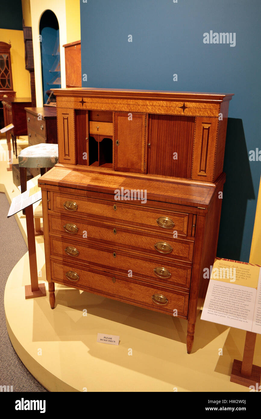 A red maple wood writing desk in the Donald R. Friary Exhibition Gallery, Flynt Center of Early New England Life, Historic Deerfield, Ma, USA. Stock Photo
