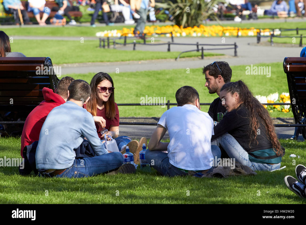 people having outdoor lunch on a sunny spring day in st stephens green park city centre Dublin Republic of Ireland Stock Photo
