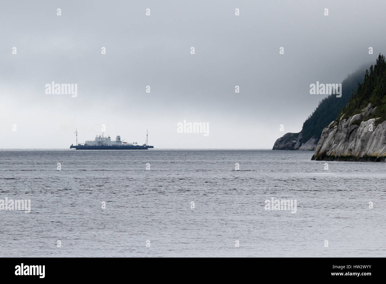 The TadoussacBaieSainteCatherine Free Ferry crosses the mouth of Saguenay Fjord Stock Photo