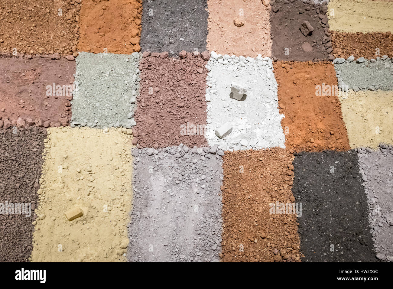 Texture of different colors of dry clay with stones Stock Photo