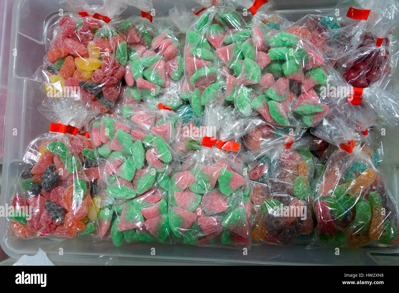 Bins of sugary sweets and candy for sale in bags Stock Photo