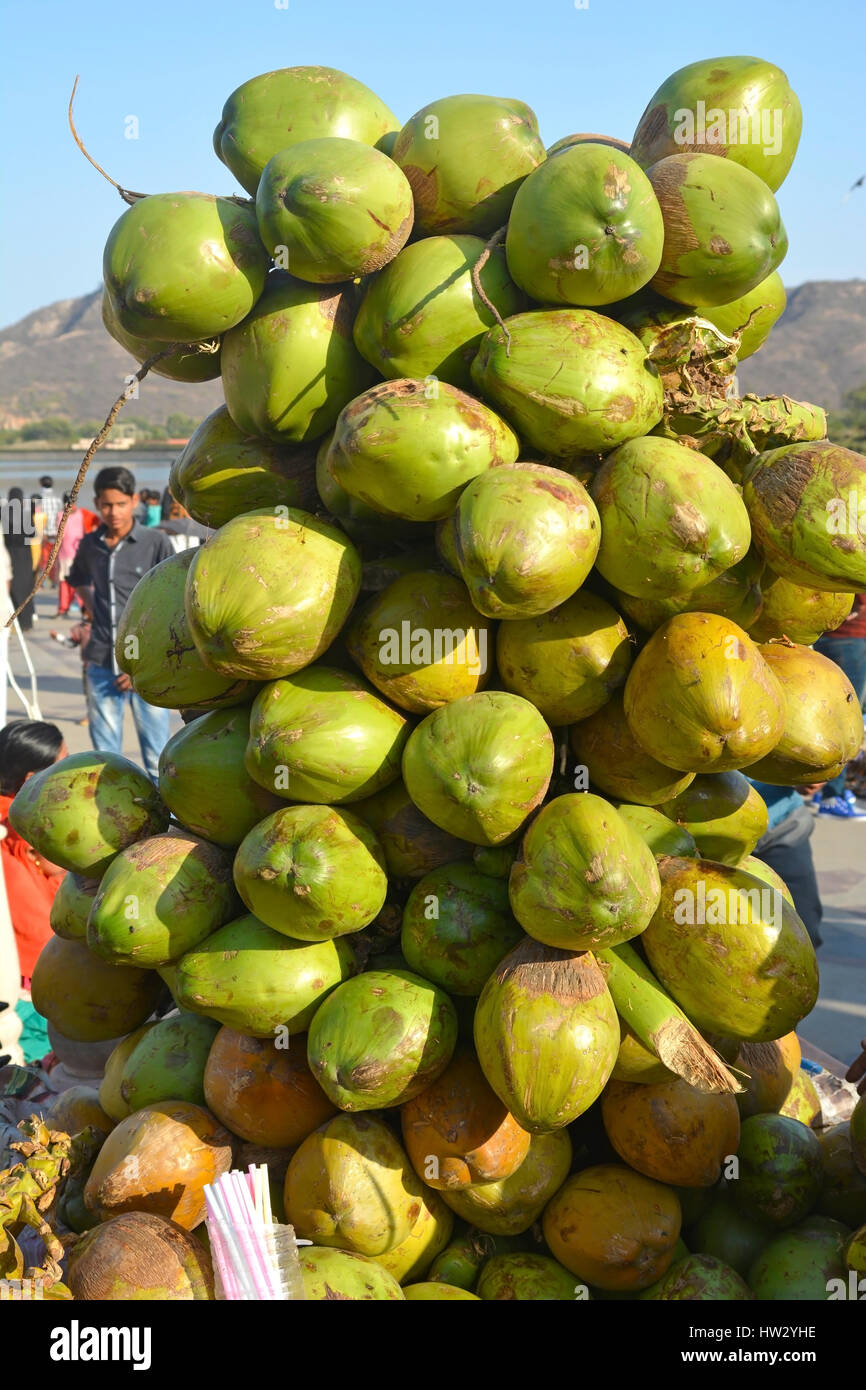 coconuts fruits stacked for making juice water refreshment Stock Photo