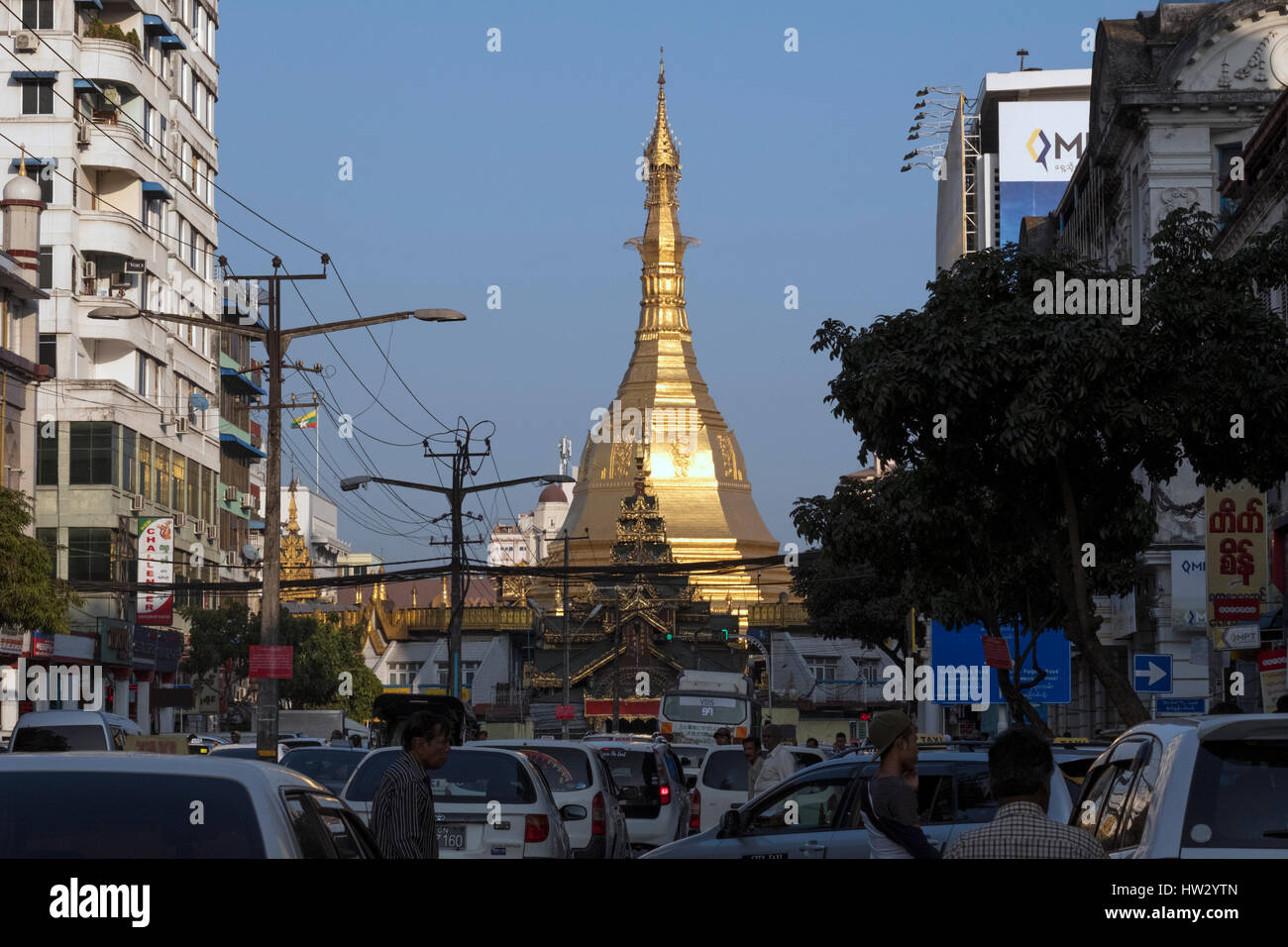 Sule pagoda towers over the traffic on Maha Bandoola Road in downtown Yangon, Yangon Region, Myanmar Stock Photo