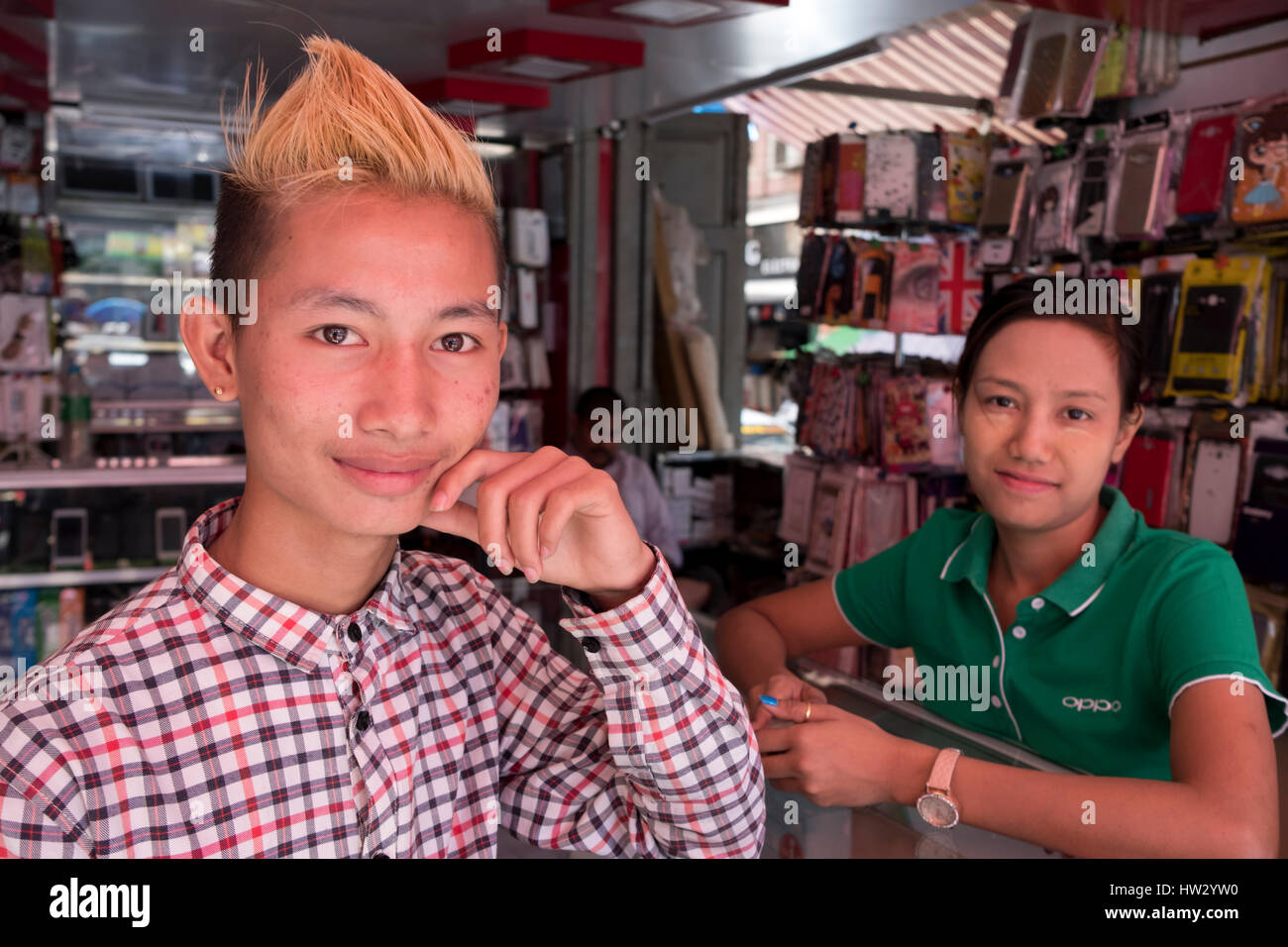 Sales persons at a mobile phone store in Maha Bandoola Road, Yangon