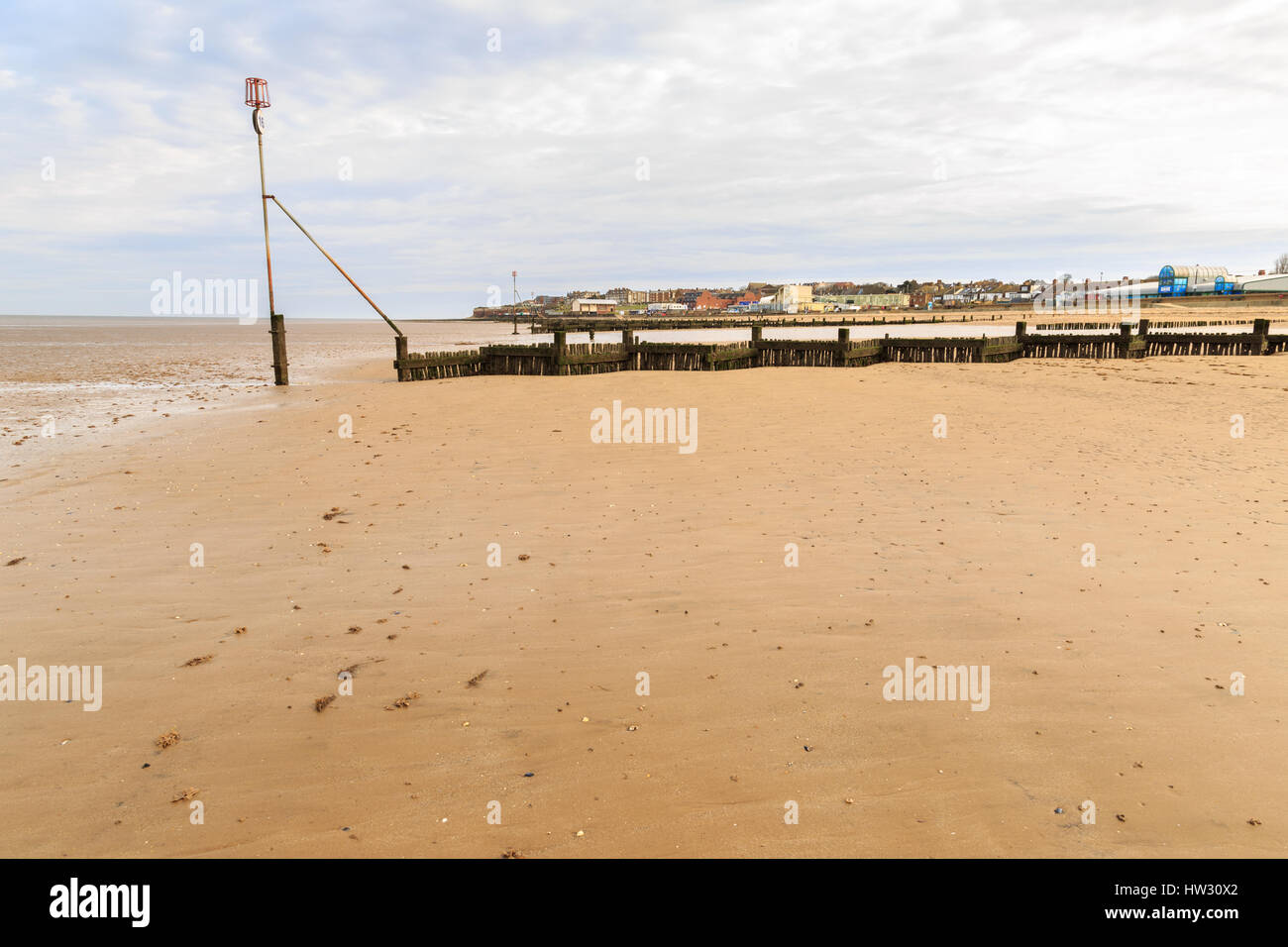 Hunstanton beach with wooden breakwater on an early Spring day. Stock Photo