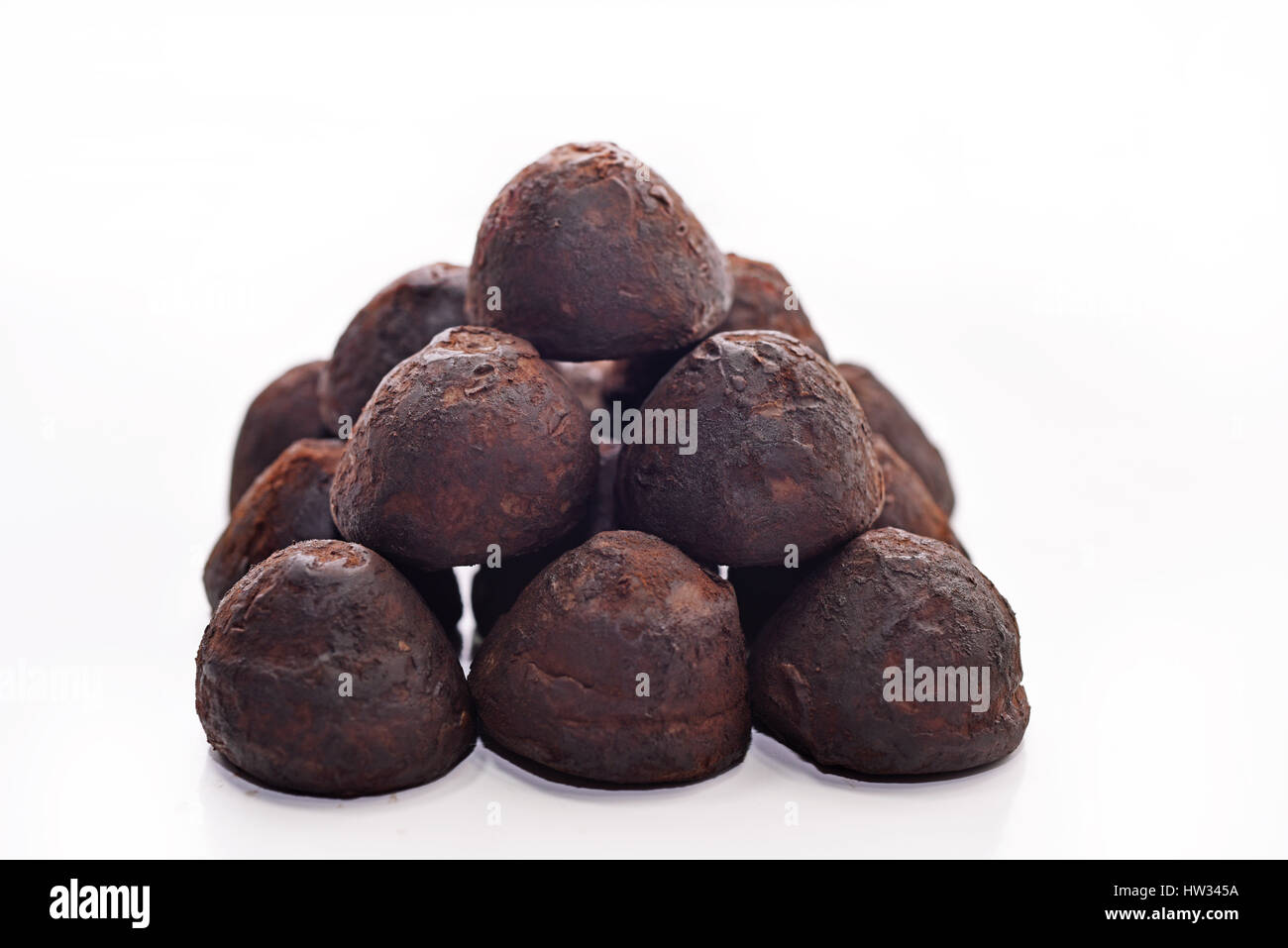 Pyramid of chocolate. Isolated on white background Stock Photo - Alamy