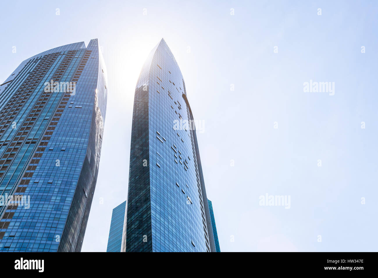 Abstract modern business buildings and blue sky in Singapore finance district, copy-space, skyscrapers and towers Stock Photo