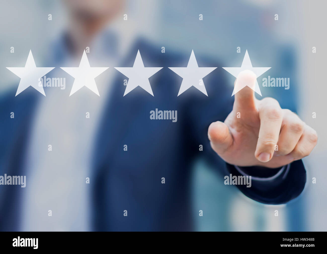 Five stars (5) rating with a businessman touching screen, concept about positive customer feedback and review, excellent performance Stock Photo