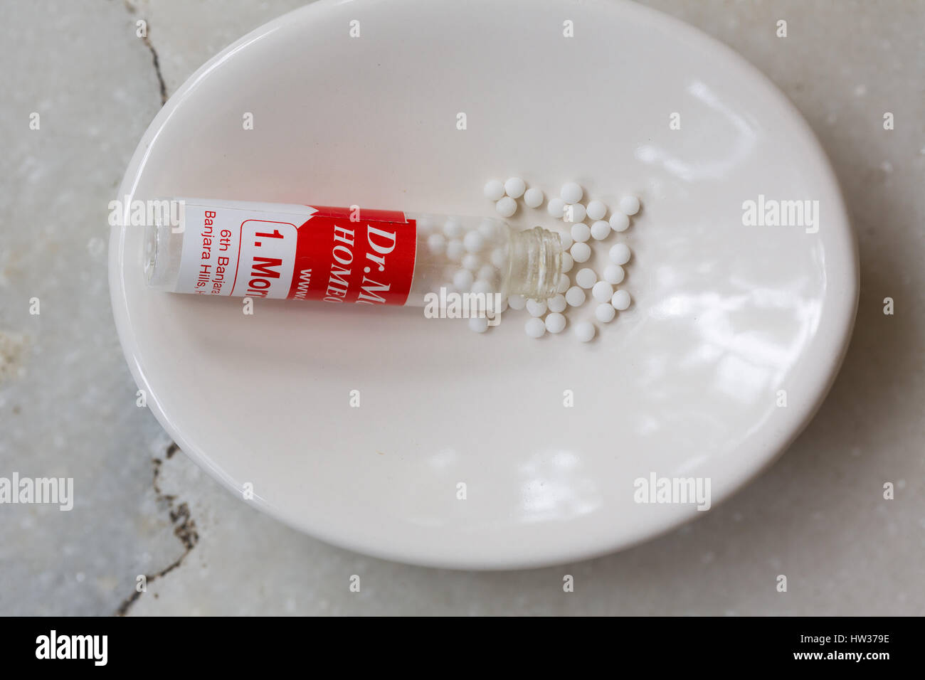 Closeup of Homeopathy Medicine globules on a white background Stock Photo